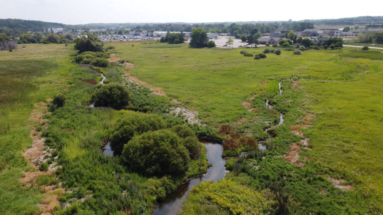 aerial view of the watershed center project by inhabitect